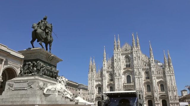 Lot of pigeons fly over Piazza del Duomo in Milan, Italy

