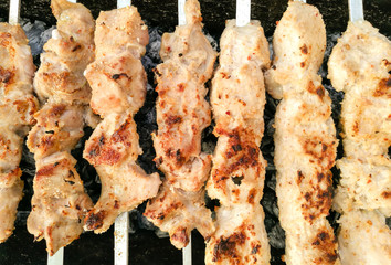 Shish kebab on metal sticks roasted on the grill