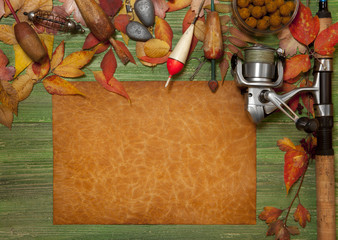 Fishing tackle on wooden background