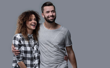 young couple discussing their dreams and pointing forward.