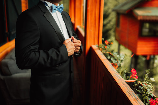 Midsection of man in tuxedo