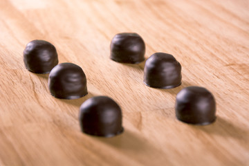 Set of darkness chocolate pralines  bonbon on wood table 