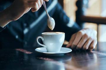 man, coffee mug, hands, spoon