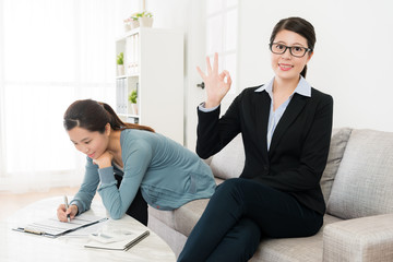 professional business woman showing okay gesture