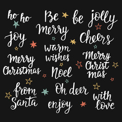 Fototapeta na wymiar Christmas holidays hand lettering set. Calligraphy phrases collection