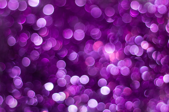 Purple shiny glitter holiday beautiful abstract blur bokeh background
