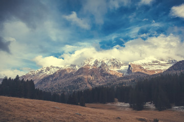 Naklejka na ściany i meble Beautiful mountain landscape, Dolomites, Italy. Snowy peaks, magnificent nature