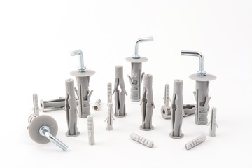 a series of metal clips with the plastic plugs on a white background	