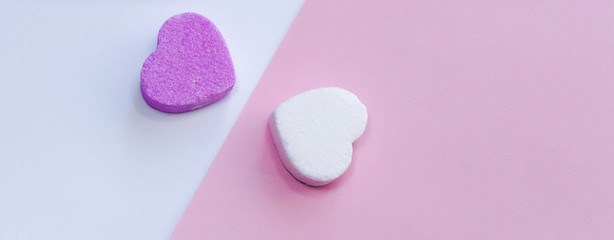 White and pirple candies in shape of heart