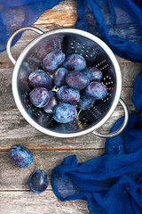 Fresh plums  on  dark background