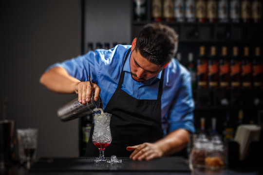 Bartender pouring fresh cocktail