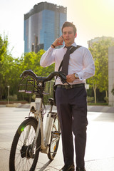 Fototapeta premium Young buinessman riding to work in the city