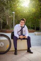 Young buinessman riding to work in the city