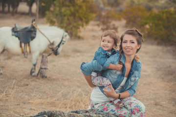 Romantic scene beautiful lady young mother with her cute baby daughter enjoy time together in city...