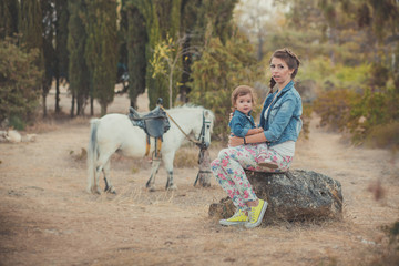 Romantic scene beautiful lady young mother with her cute baby daughter enjoy time together in city...