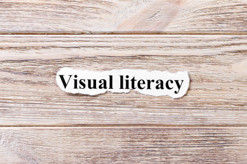 visual literacy of the word on paper. concept. Words of Avisual literacy on a wooden background