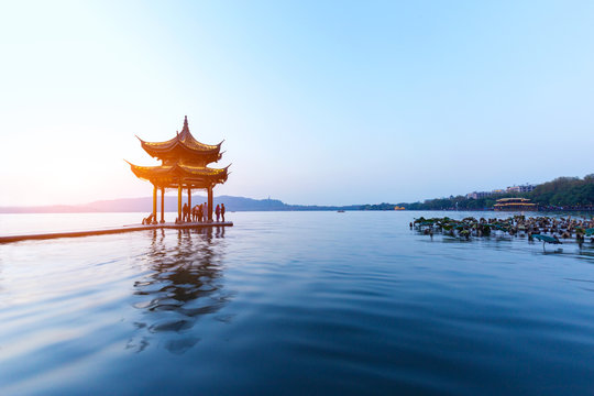 old style pavilion in west lake at twilight