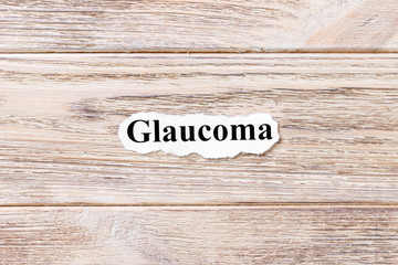 glaucoma of the word on paper. concept. Words of glaucoma on a wooden background