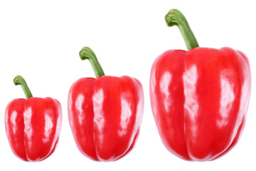 three sweet red peppers isolated on white