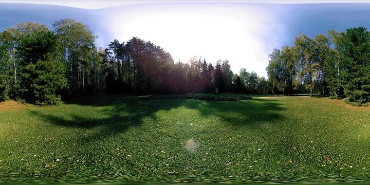 UHD 4K 360 VR Virtual Reality of a city park recreation area. Trees and green grass at autumn or summer day. Path and sun rays. Original sound.