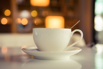 Coffee cup in coffee shop - vintage style effect picture