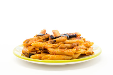 Spaghetti with aubergine and tomato sauce on a the table