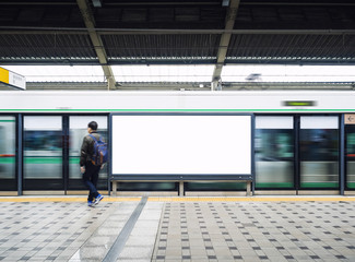 Blank Billboard Banner Light box in Subway station with blurred people Travel