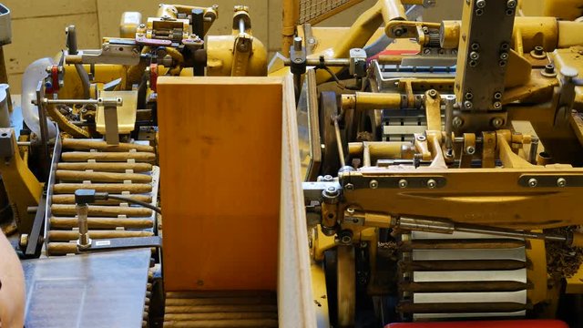 Cigar rolling machine inside a cigar factory producing homemade cigars &ndash; 4K