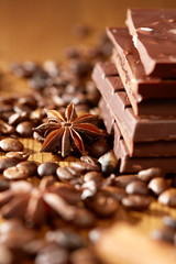 Aroma coffee chocolate cookies and spices on the wooden table. Dark wooden background. Top view. Close. Closeup.