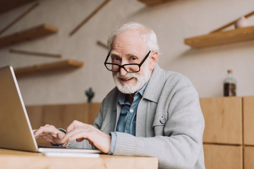 senior man working with laptop