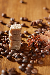 Aroma coffee chocolate cookies and spices on the wooden table. Dark wooden background. Top view. Close. Closeup.