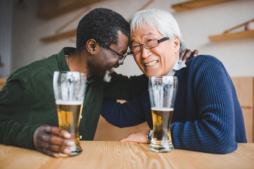 senior friends drinking beer