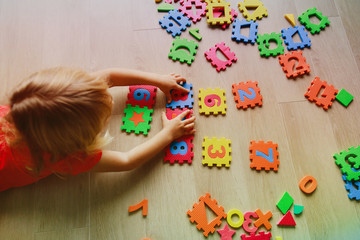 little girl learning numbers, education concept