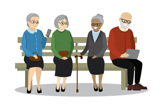 old people or pensioners sitting on bench