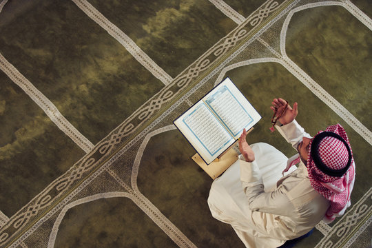 muslim man praying inside the mosque