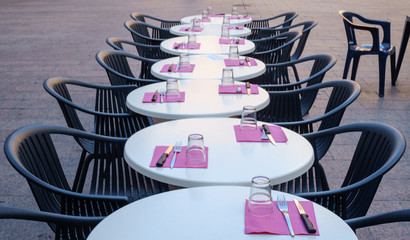 Served tables of a street cafe.