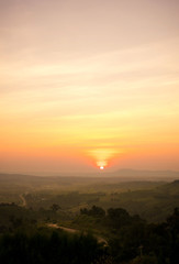 Light orange in the sky shining light. With the peaceful nature and the fresh air. While looking at the sunset.