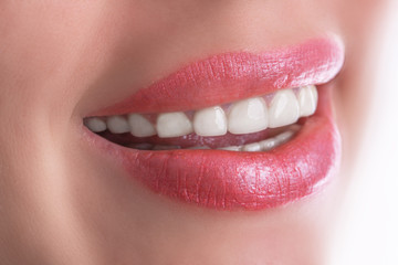 Naklejka premium Smiling woman mouth with great teeth on white background