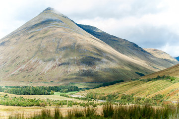 Great scottish mountains in sunlight at spectacular fall season