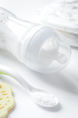 Fototapeta na wymiar preparation of mixture baby feeding on white background