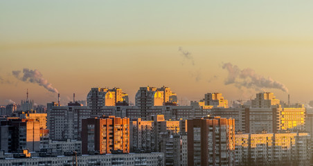 Fototapeta premium Residential arrays of high-rise buildings on the horizon sunset.