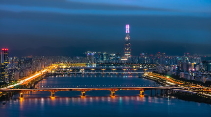 Fototapeta na wymiar Morning Skyline Lotte World mall on the Han River Ganges In South Korea ทวีปเอเชียทวีปเอเซียเอเชียความเป็นมาฉากหลังปูมหลังพื้นหลังภาพพื้นเดิมพื้นเพเดิมภูมิหลังรกรากเดิมหัวนอนปลายตีนเบื้องหน้าเบื้องหล
