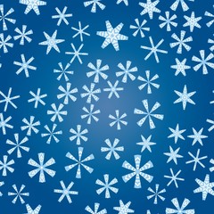 Seamless pattern with abstract colorful snowflakes on blue background. Chaotic, random, scattered winter motives. Vector illustration.