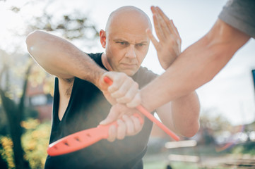 Knife vs knife. Kapap instructor demonstrates fighting and disarming technique