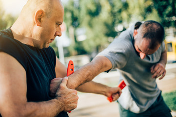 Knife vs knife. Kapap instructor demonstrates fighting and disarming technique