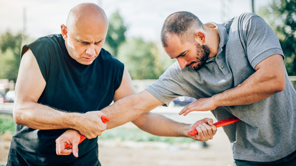 Knife vs knife. Kapap instructor demonstrates fighting and disarming technique