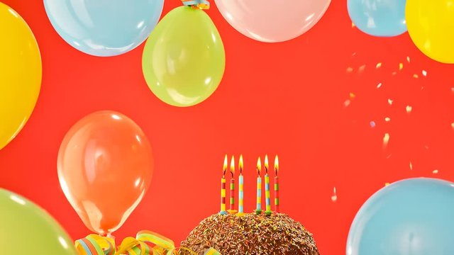 chocolate birthday cake with ballons and candles