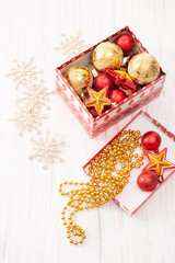 Christmas balls in gift box on white background