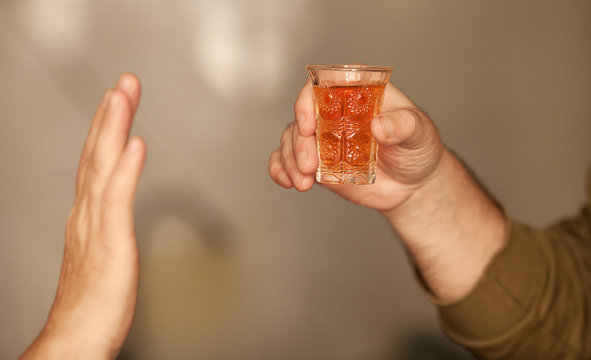 Man Saying No More To Alcohol With His Body Language