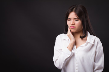 painful woman with toothache, tooth decay, sensitivity
